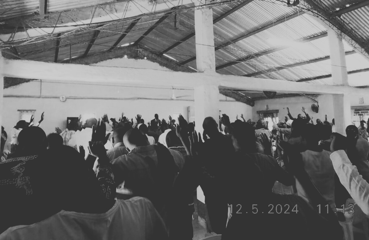 Church worship service with raised hands